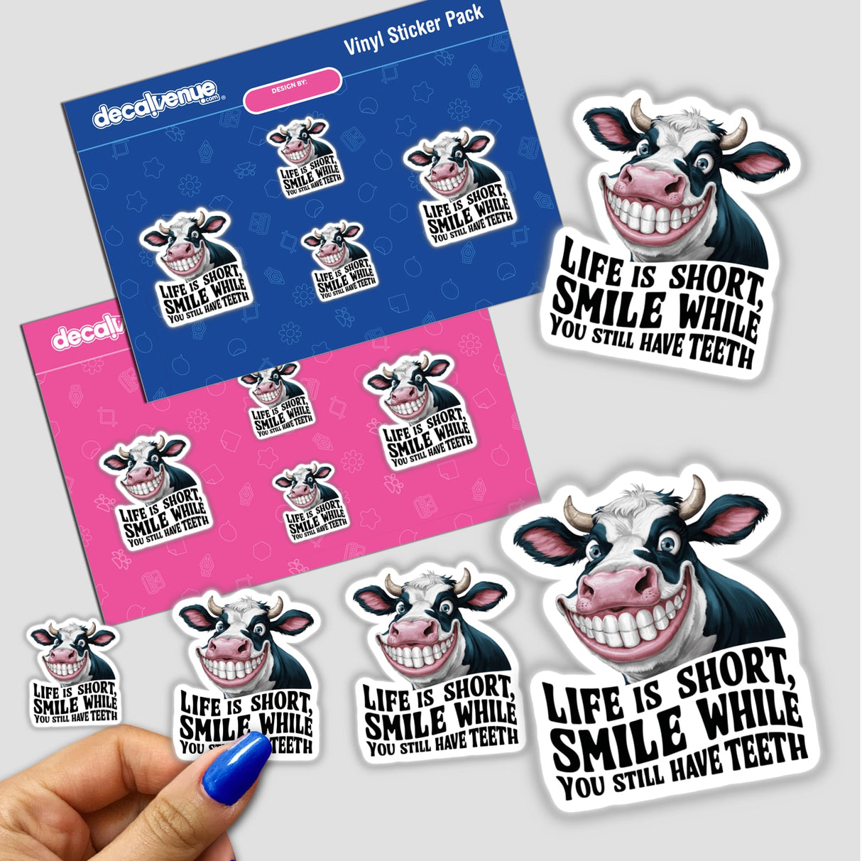 Vibrant cow-themed stickers with humorous, motivational text - "Life is Short. Smile While You Still Have Teeth." Displayed on a Decal Venue product page showcasing the playful, stylized designs.