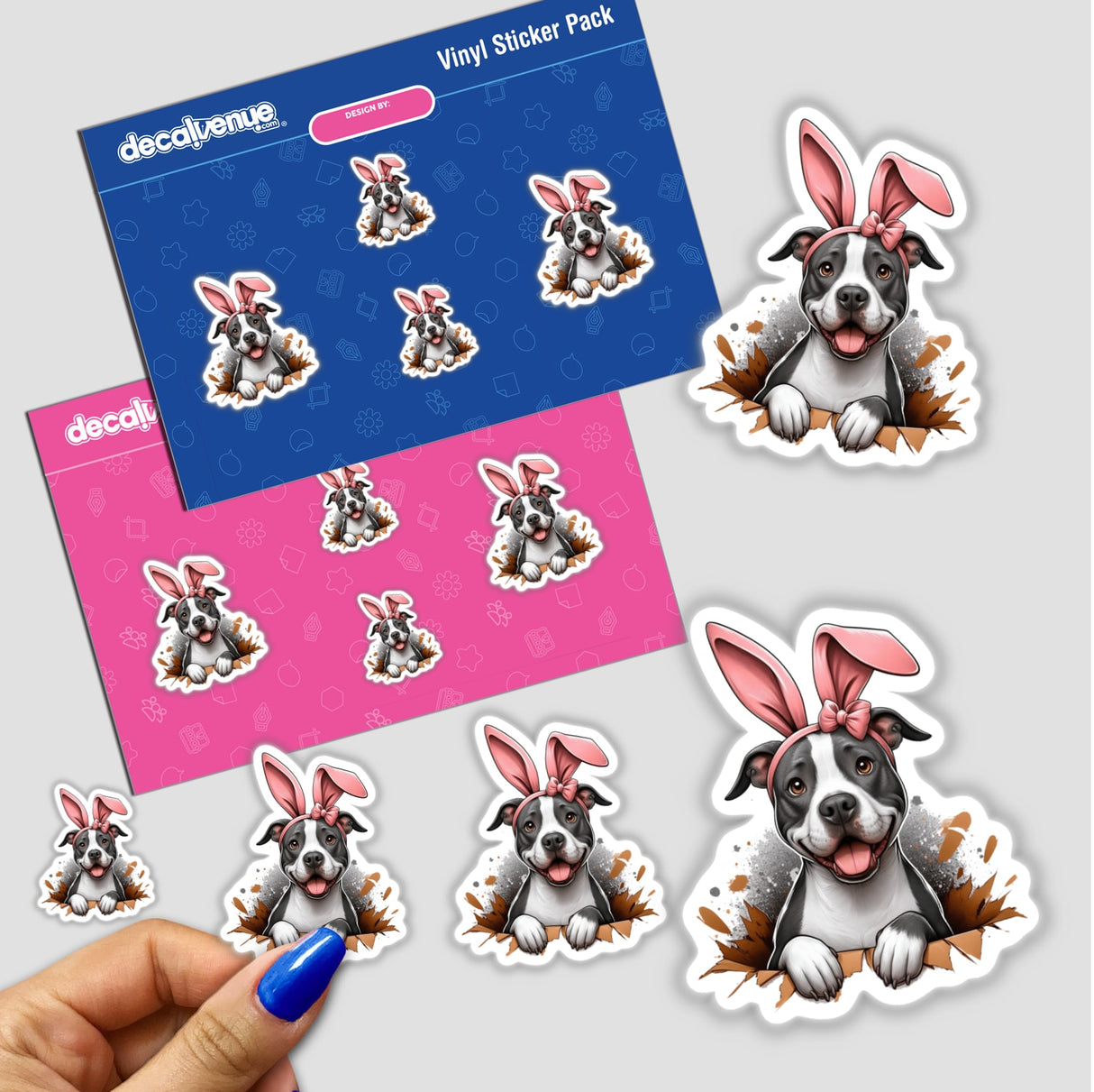 Peek a Boo Pitbull Bunny sticker pack featuring cartoon pitbulls with bunny ears, showcasing unique vinyl designs. Includes a close-up of a hand holding a sticker from Decal Venue.