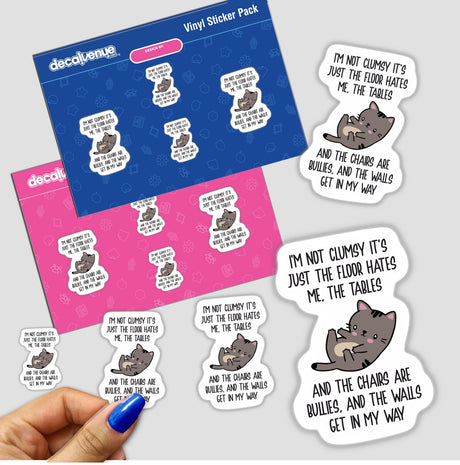 Hand holding Not Clumsy sticker pack featuring whimsical cat illustrations, part of Decal Venue's unique vinyl sticker collection available as physical or digital artwork.