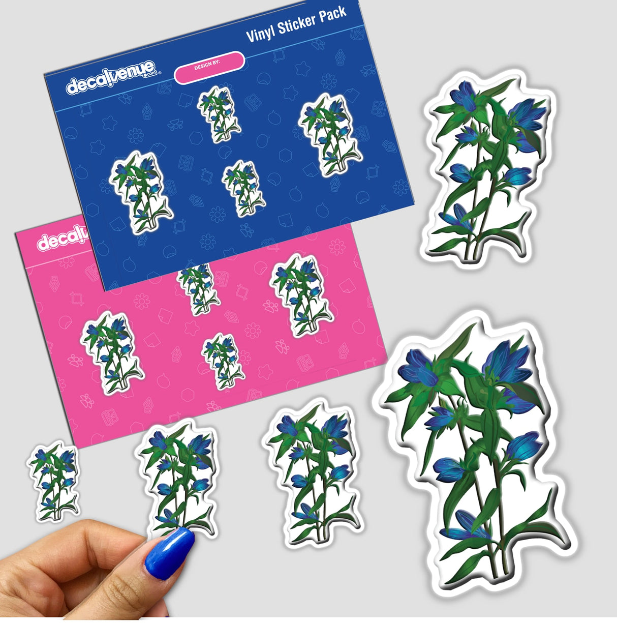 Hand holding an American Wild Flowers sticker featuring a plant with blue flowers, part of Decal Venue's unique sticker and digital art collection.