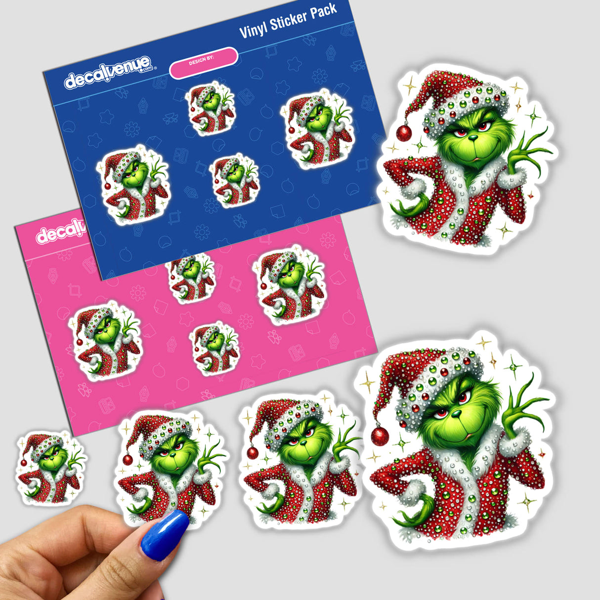 Sassy Christmas Green Grouch Rhinestone Santa sticker featuring a cartoon green character in a Santa outfit, held in a hand, exemplifying Decal Venue's unique sticker collection.