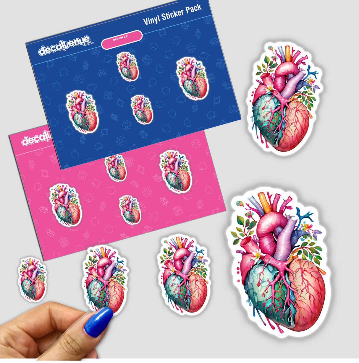 Botanical Heart Sticker - Organic Floral Kawaii Nature-Inspired Design: A hand holding a vibrant sticker depicting a human heart adorned with flowers and leaves.