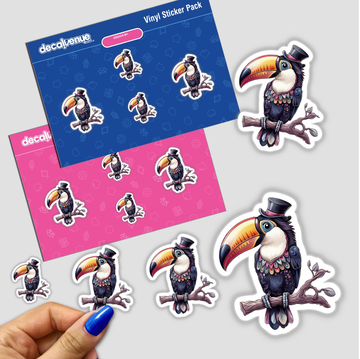 Elegant Toucan with a Colorful Beak and Stylish Top Hat sticker pack, featuring cartoon birds, held in a hand. Available as stickers or digital artwork from Decal Venue.