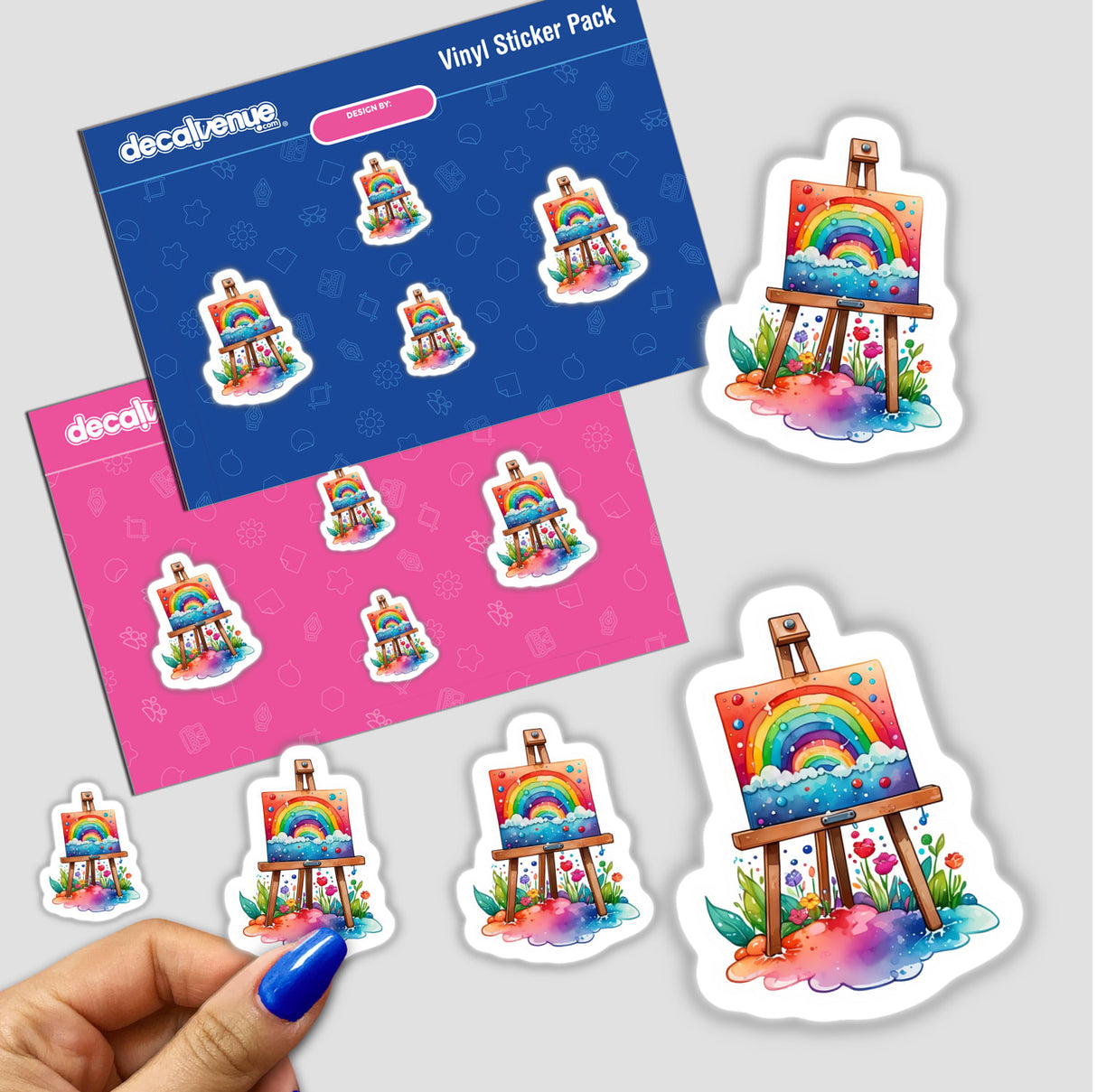 Stickers and cards featuring rainbow designs on an easel and canvas, available as stickers or digital artwork, showcasing Decal Venue's unique collection.