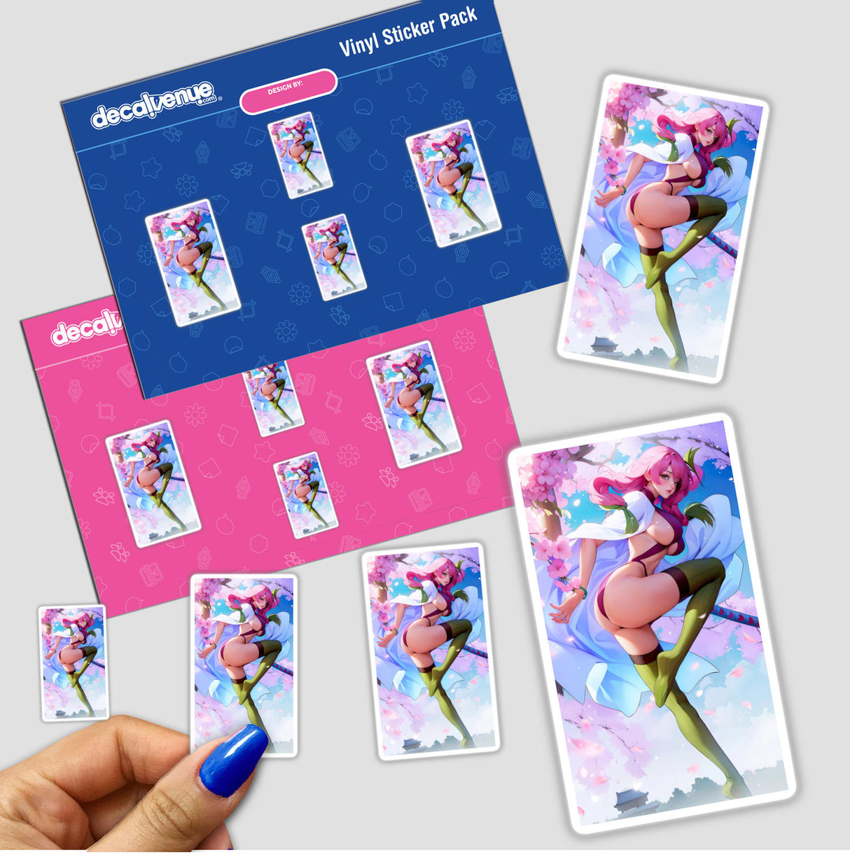 Hand holding a FiestyGirl Ninja sticker pack featuring cartoon characters, including a woman with pink hair and various other animated designs.