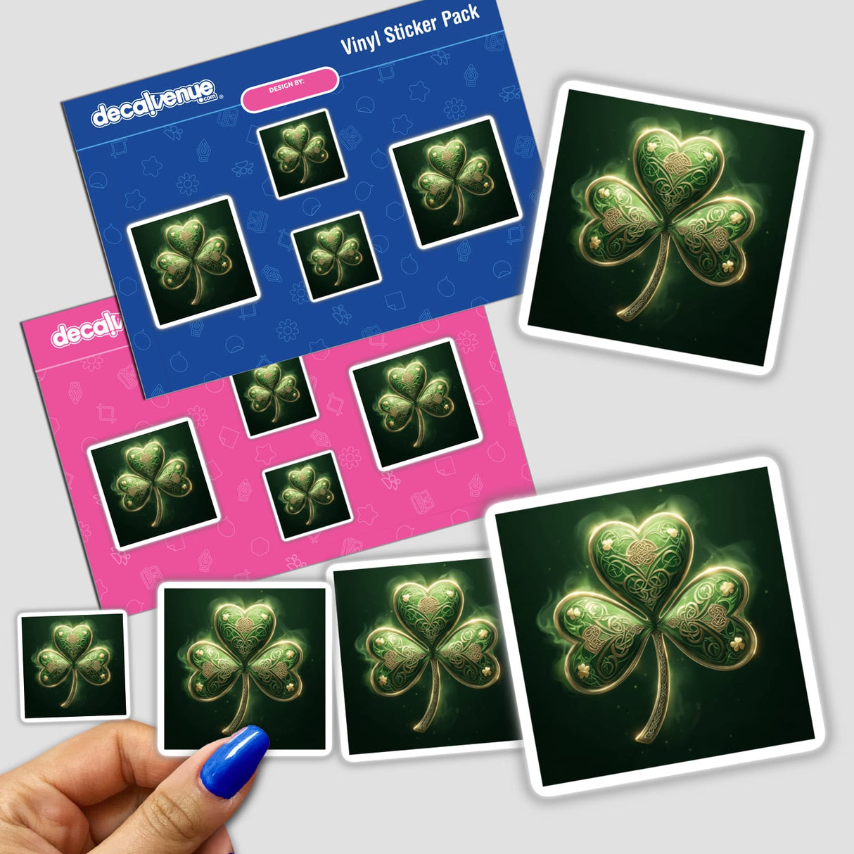 Celtic Shamrock sticker pack featuring green clovers with intricate gold knotwork, held in a hand, showcasing Decal Venue's unique vinyl sticker and digital art offerings.