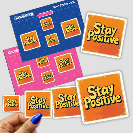 Hand holding Stay Positive stickers, showcasing motivational words, available as both stickers and digital artwork from Decal Venue, specializing in unique sticker designs and digital art collections.