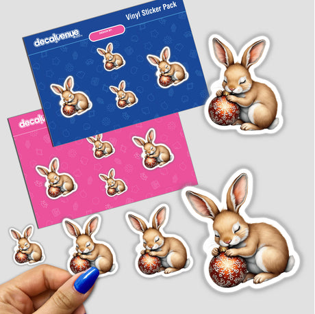 Sticker pack featuring a cartoon rabbit sleeping on a Christmas ornament, available as stickers or digital artwork. Perfect for adding a festive touch to your collection.