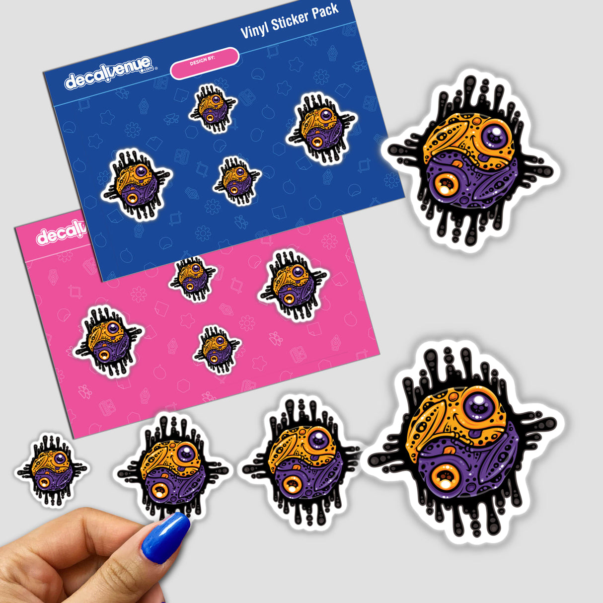 Vibrant Purple and Gold Poison Dart Frog Yin Yang sticker, held in hand, showcasing a unique cartoon design with bold graphic elements, available as a sticker or digital artwork.