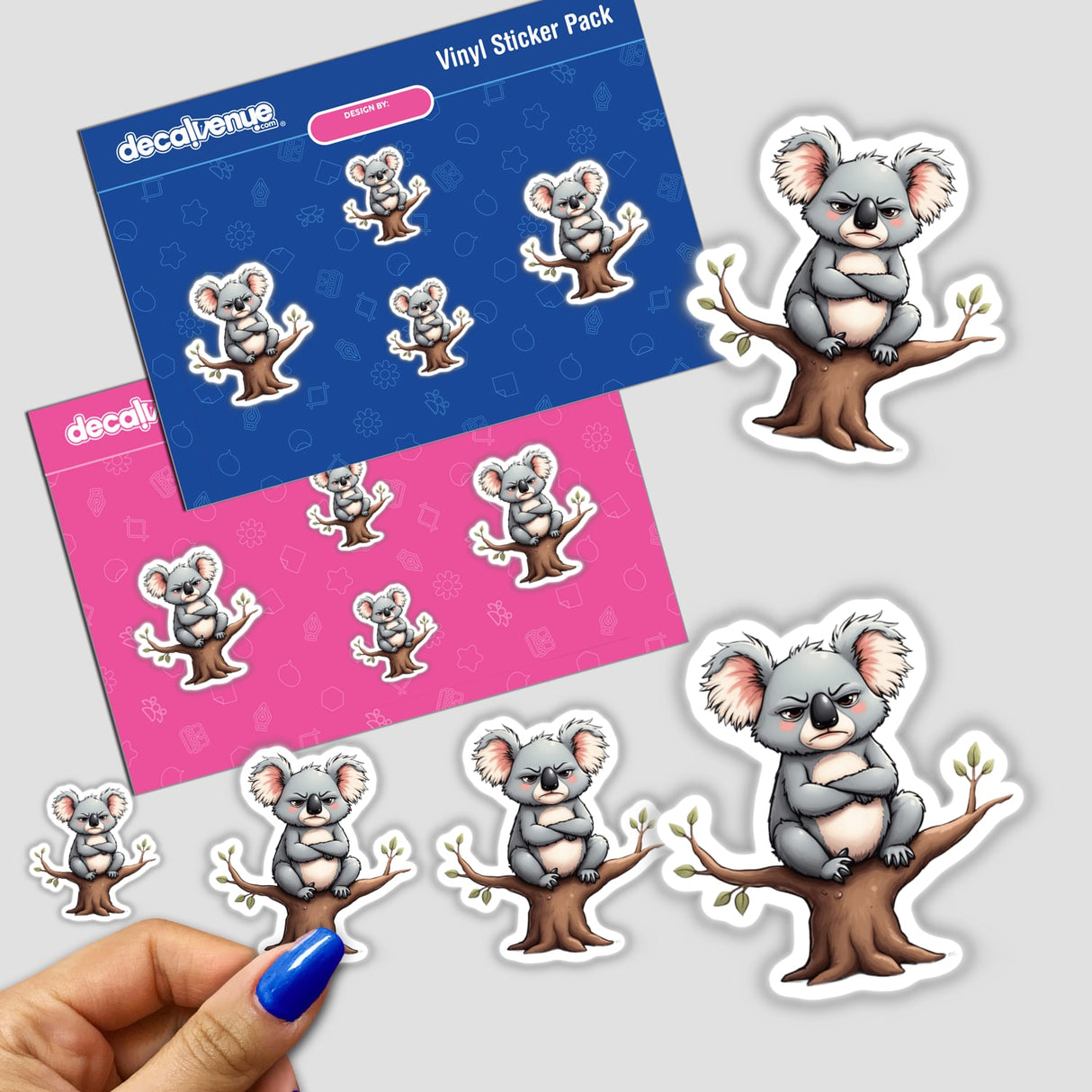 Angry Koala Sitting on a Branch with Crossed Arms sticker pack featuring various cartoon koalas in different poses, emphasizing the unique and playful designs offered by Decal Venue.