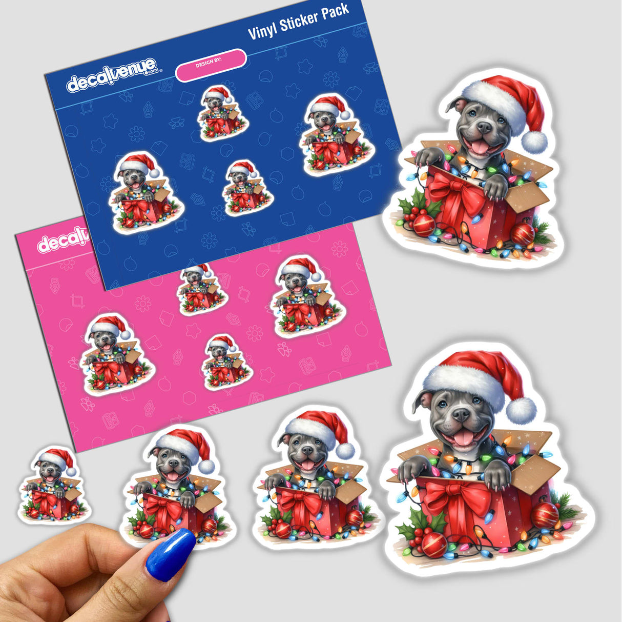 Santa Pitbull Dog in a Christmas Box IV sticker, featuring a cartoon dog wearing a Santa hat inside a lit-up box. Part of a sticker pack available at Decal Venue.