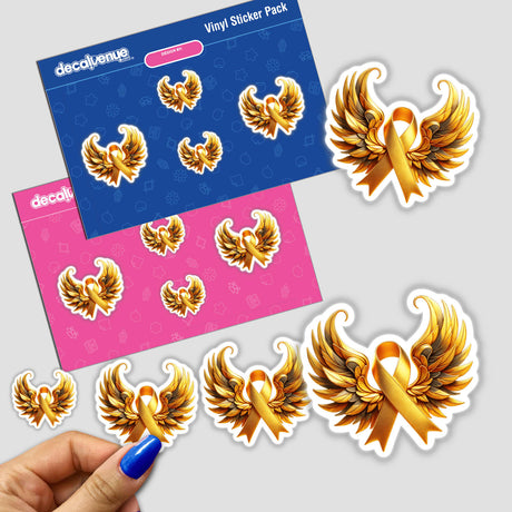 Gold Awareness Ribbon with Wings sticker featuring intricate wing designs, held by a person's hand. Available as both a sticker and digital artwork, reflecting Decal Venue's unique vinyl sticker collection.