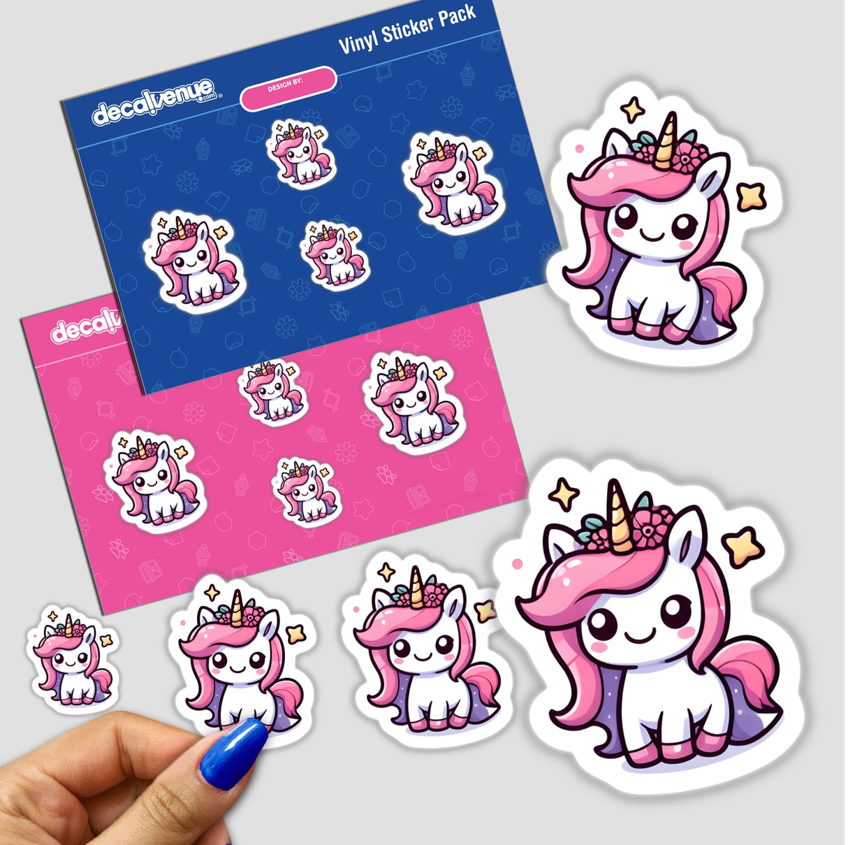 Colorful stickers featuring adorable pink unicorn characters in various poses with stars and patterns, displayed on a product packaging for the Decal Venue online shop offering unique digital artwork and stickers.