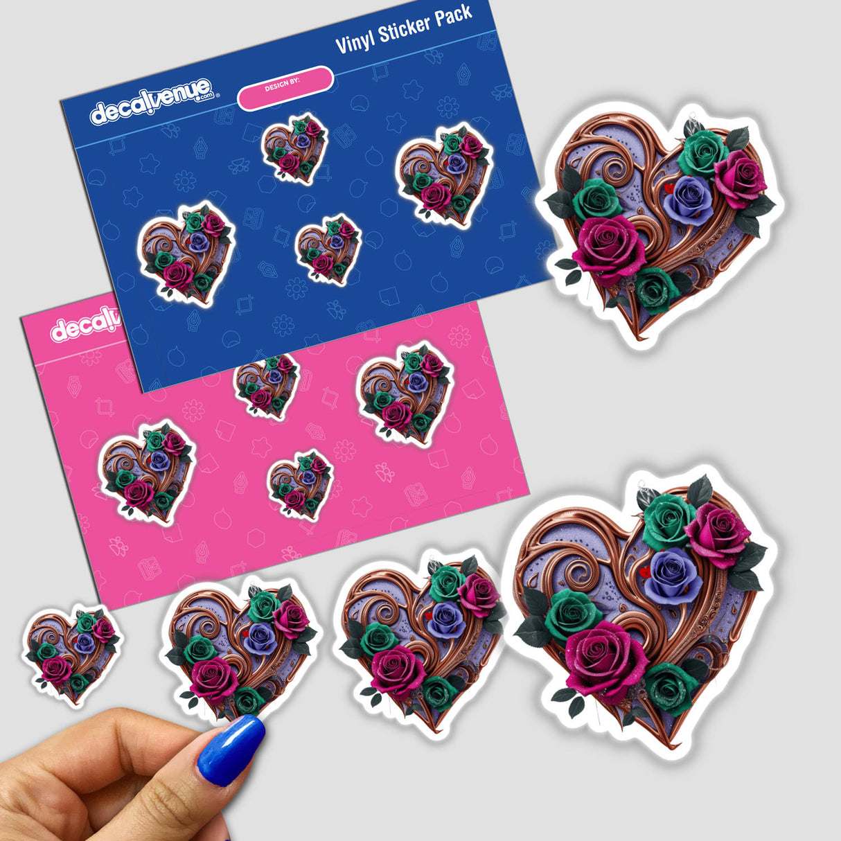 Bronze Swirl Heart with Green, Pink, and Purple Roses sticker pack featuring heart-shaped designs and floral motifs, complemented by a close-up of a person's fingers holding the stickers.