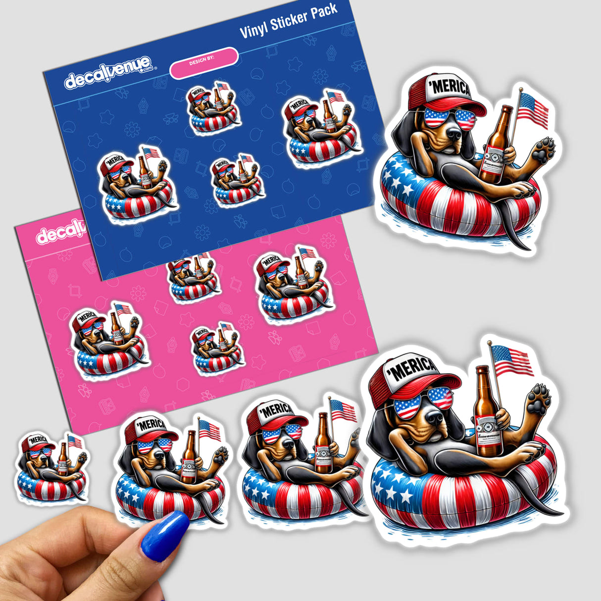 Colorful digital artwork stickers featuring a patriotic coonhound dog lounging in an American flag-themed inner tube, surrounded by symbols of American pride including fireworks, hotdogs, and sunglasses. The stickers are part of a vinyl sticker pack sold by DecalVenue, an online store specializing in unique digital art and stickers.