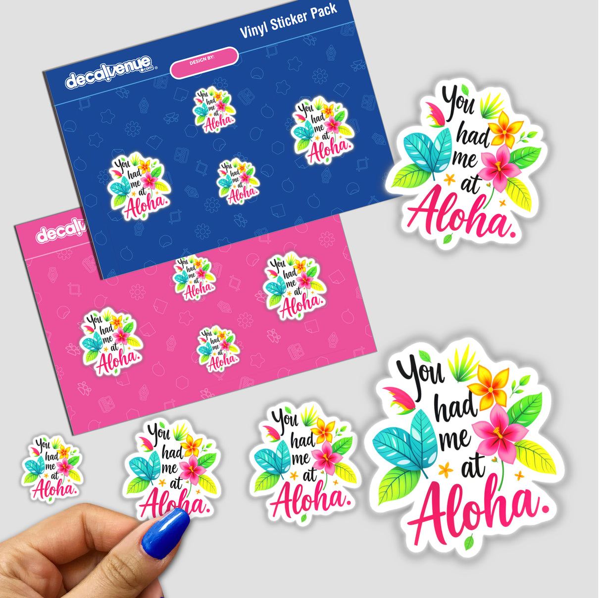 a hand holding a sticker with the words you had me at aloha