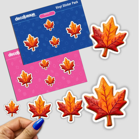 Maple Leaf Shaped Cookie with Red and Orange Autumn Colors displayed among other maple leaf-themed stickers and cookies.