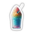 Tall glass of colorful shaved ice with a spoon