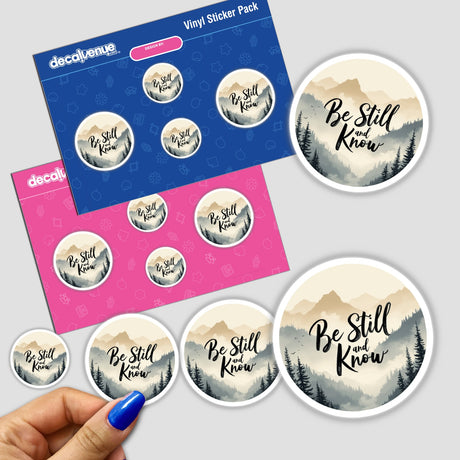 Be Still and Know Sticker & Clipart featuring a mountain landscape and inspirational Bible verse from Psalm 46:10, shown among various stickers and a hand holding the product.