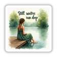 Woman on a Pier by a Lake – “Still waters run deep” depicted as a serene artwork featuring a woman with braided hair sitting on a dock, available as stickers or digital artwork.