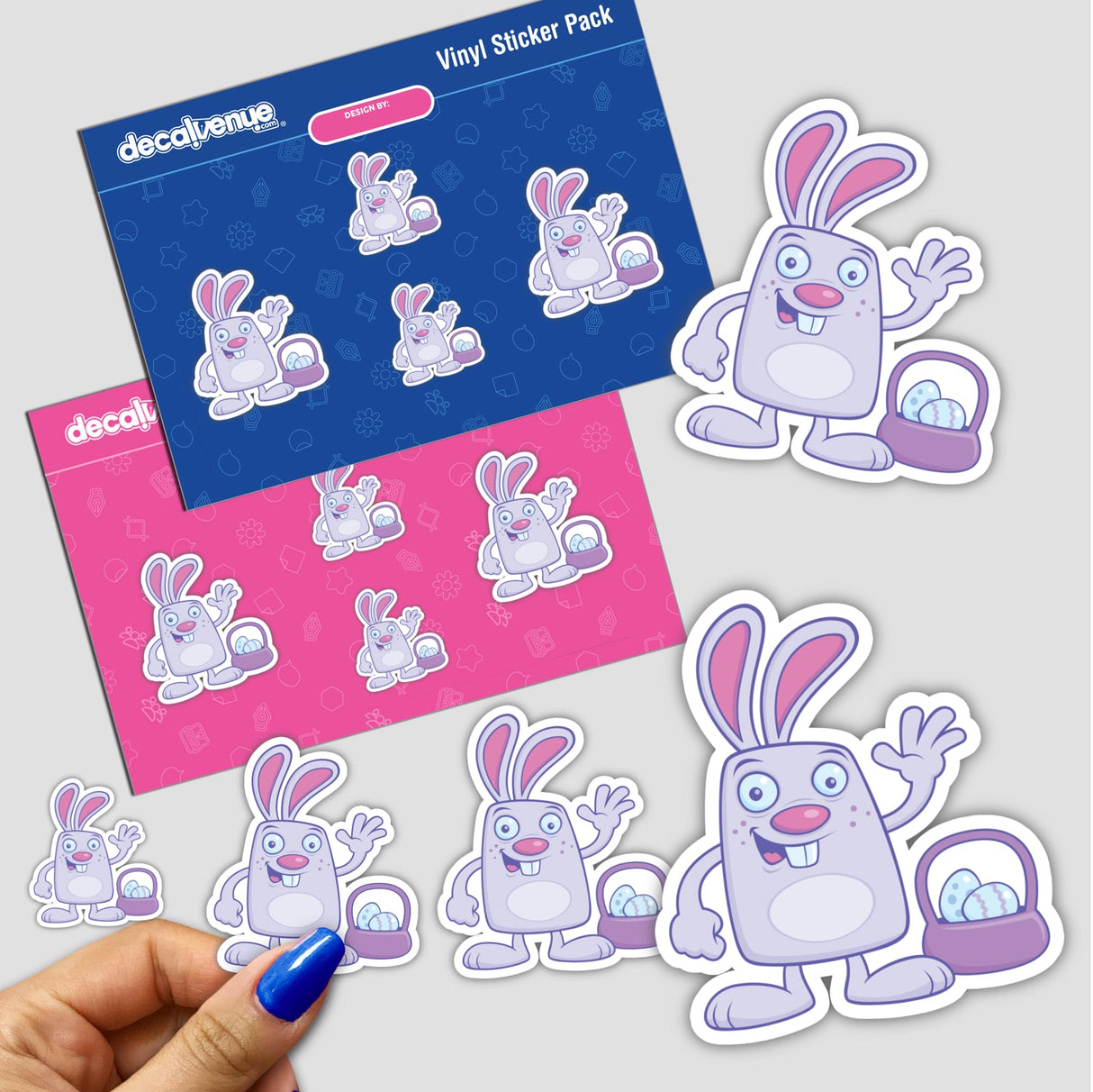 Easter Bunny sticker pack featuring cartoon rabbits holding baskets of eggs. A hand showcases one sticker, emphasizing the playful, festive design typical of Decal Venue's unique offerings.