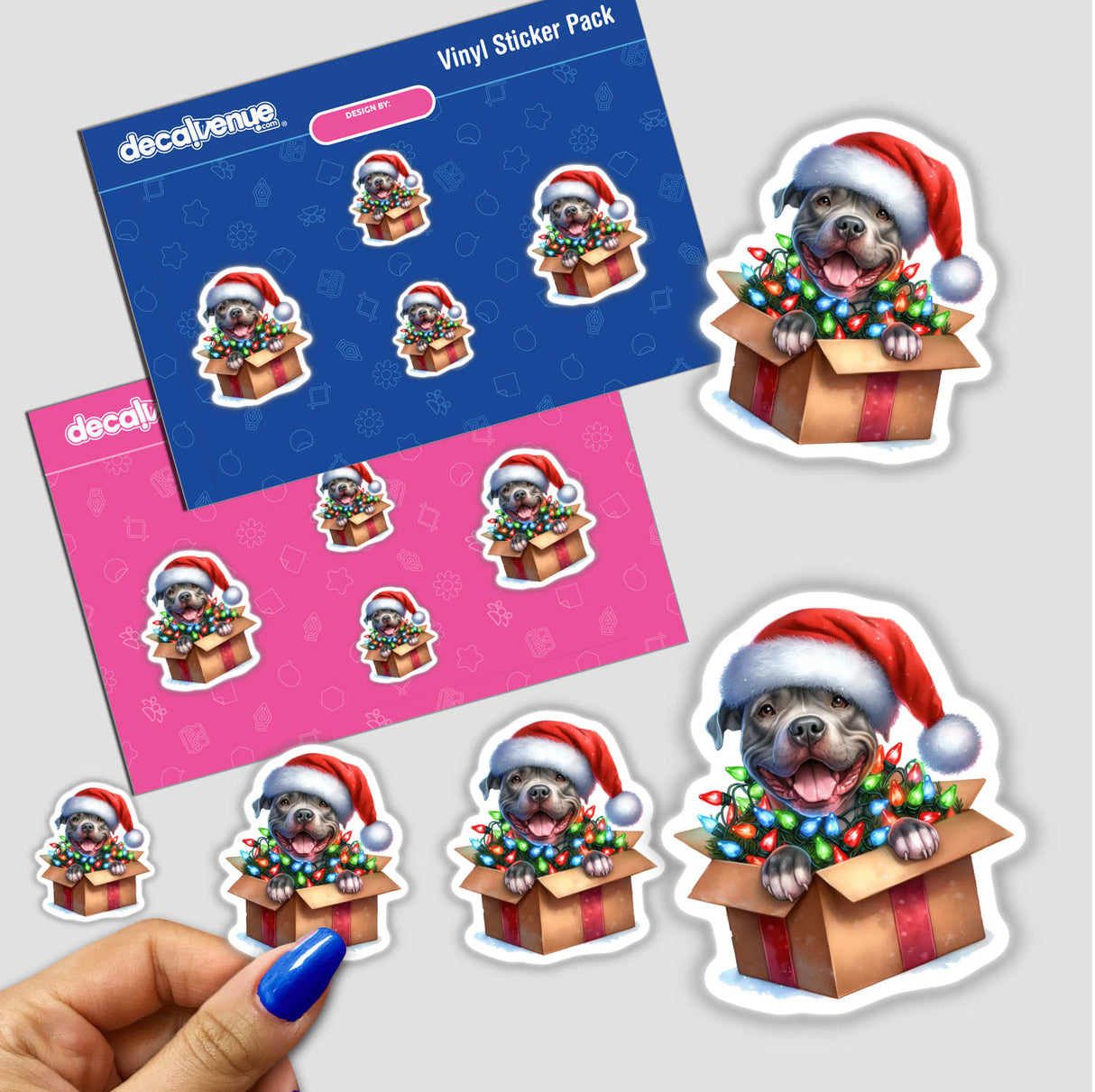 Santa Pitbull Dog in a Christmas Box II sticker pack featuring playful cartoon dogs in holiday-themed boxes adorned with lights, capturing a festive and whimsical aesthetic. Available as Stickers or Digital Artwork.