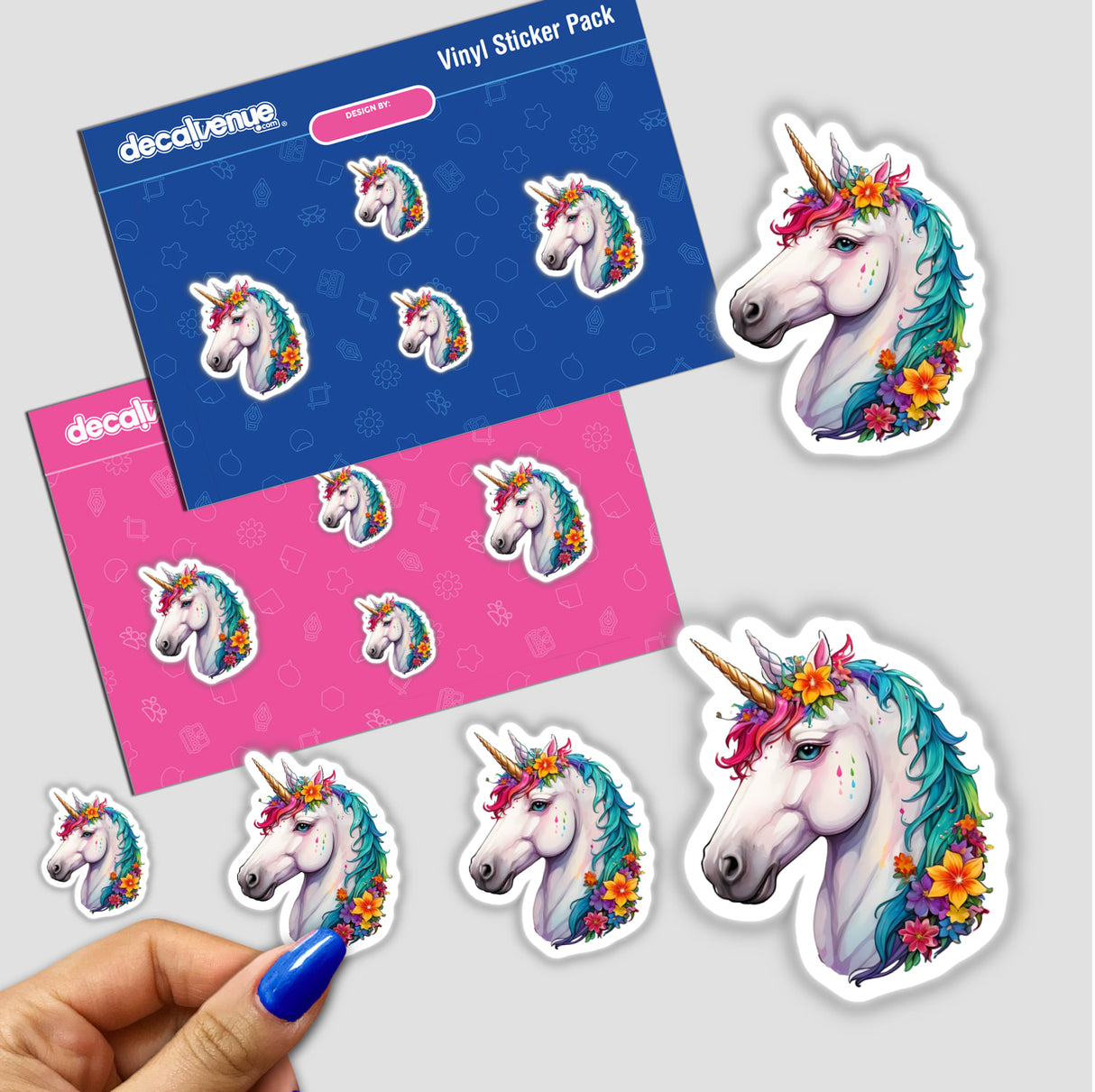 Hand holding a sticker featuring a unicorn with flowers in its mane, part of a unique sticker pack from Decal Venue.