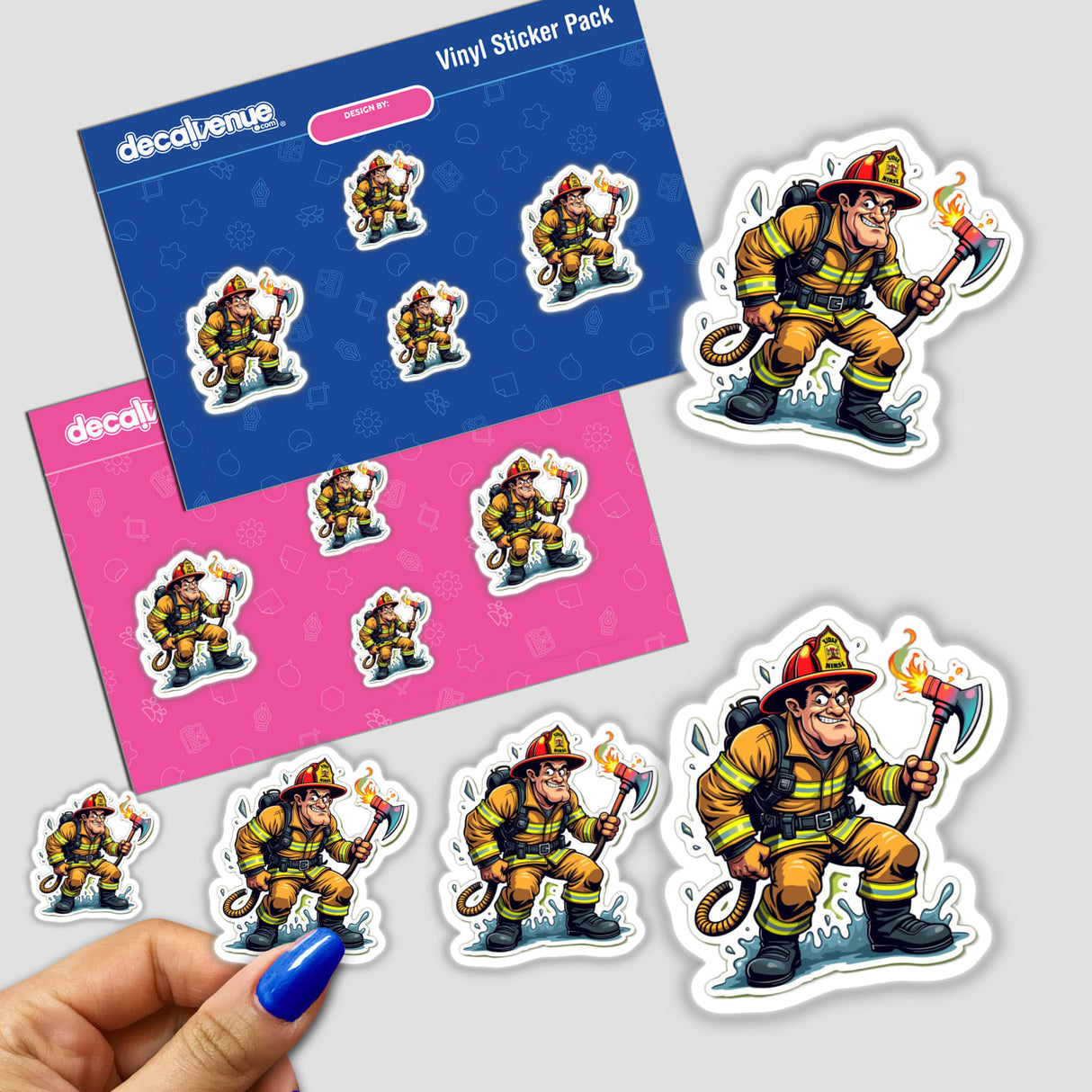 Hand holding a sticker pack titled Bombeiro Machado, featuring cartoon firefighters holding axes and hoses. Available as stickers or digital artwork from Decal Venue.