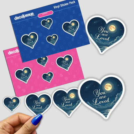 You Are Loved Sticker featuring a heart-shaped design with a moon and clouds, held by a hand, supporting mental health with positive affirmation. Available as stickers or digital artwork.