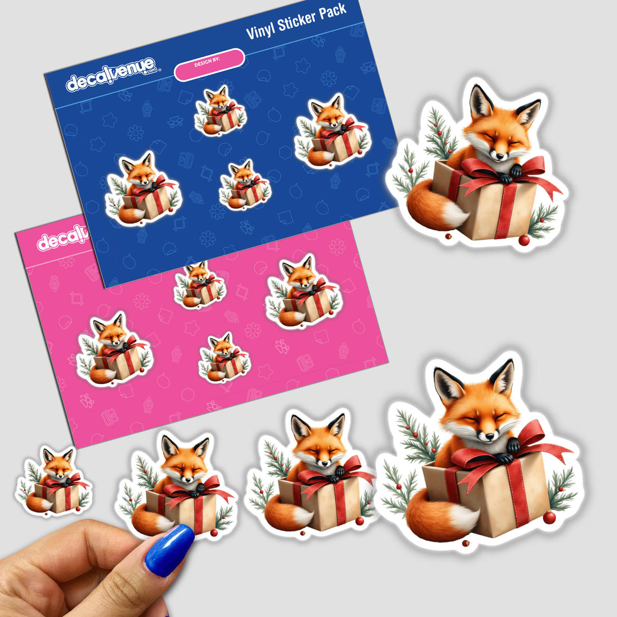 Fox in Christmas Present Box sticker pack featuring playful cartoon foxes holding gift boxes, available as stickers or digital artwork. Perfect for adding a festive touch to any surface.