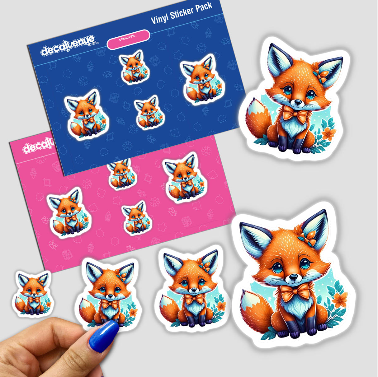 Baby Fox stickers featuring various cartoon foxes in playful poses, available as stickers or digital artwork. A close-up of a person's finger is also visible holding one sticker.