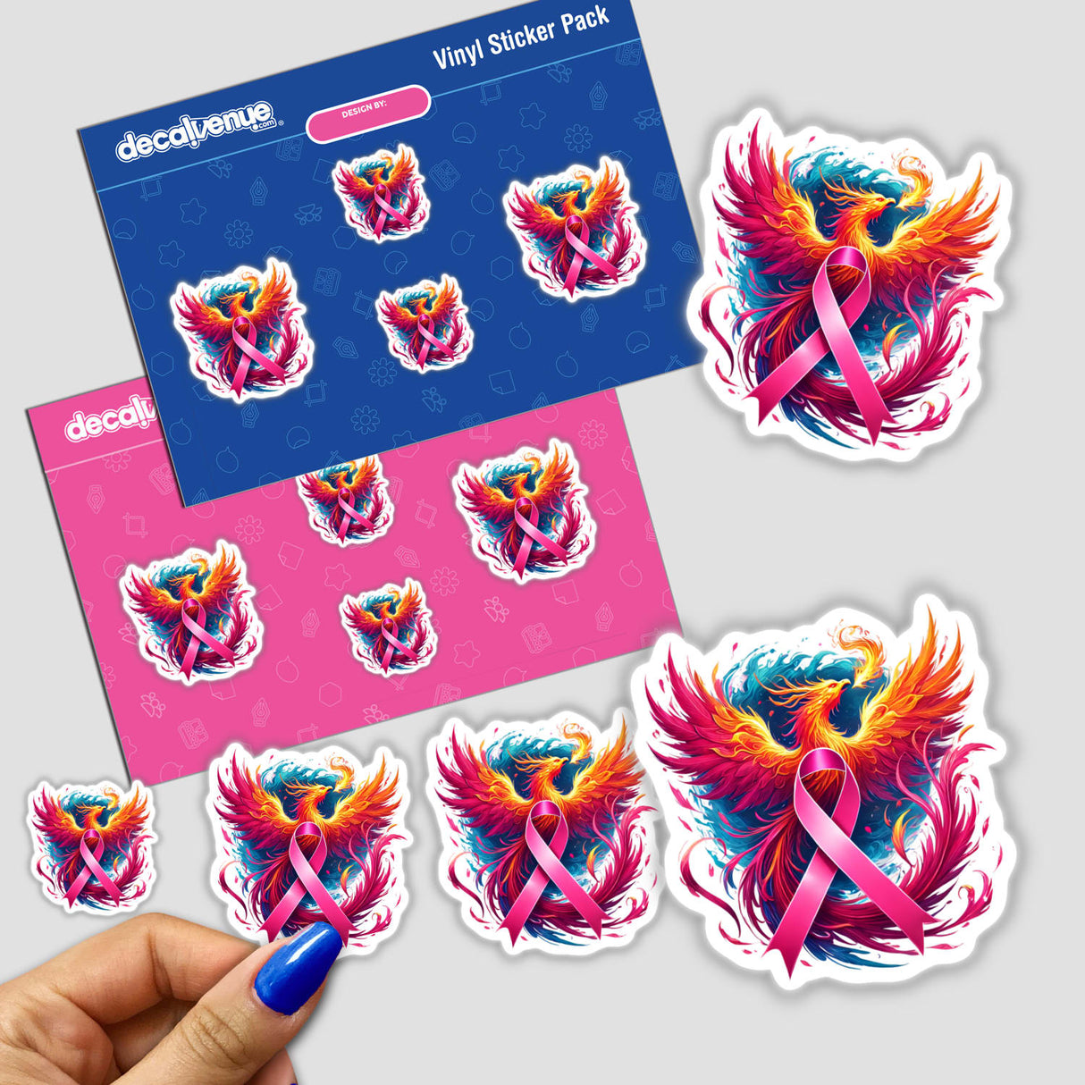 Hand holding 'Pink Ribbon and Phoenix Breast Cancer' sticker pack, featuring phoenix and bird designs with pink ribbons.