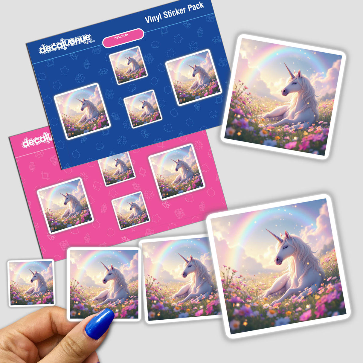 a hand holding a sticker with pictures of unicorns