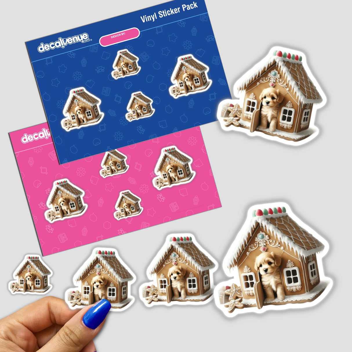 Stickers featuring a puppy peeking out of a gingerbread house, with a close-up of a hand holding the sticker pack.