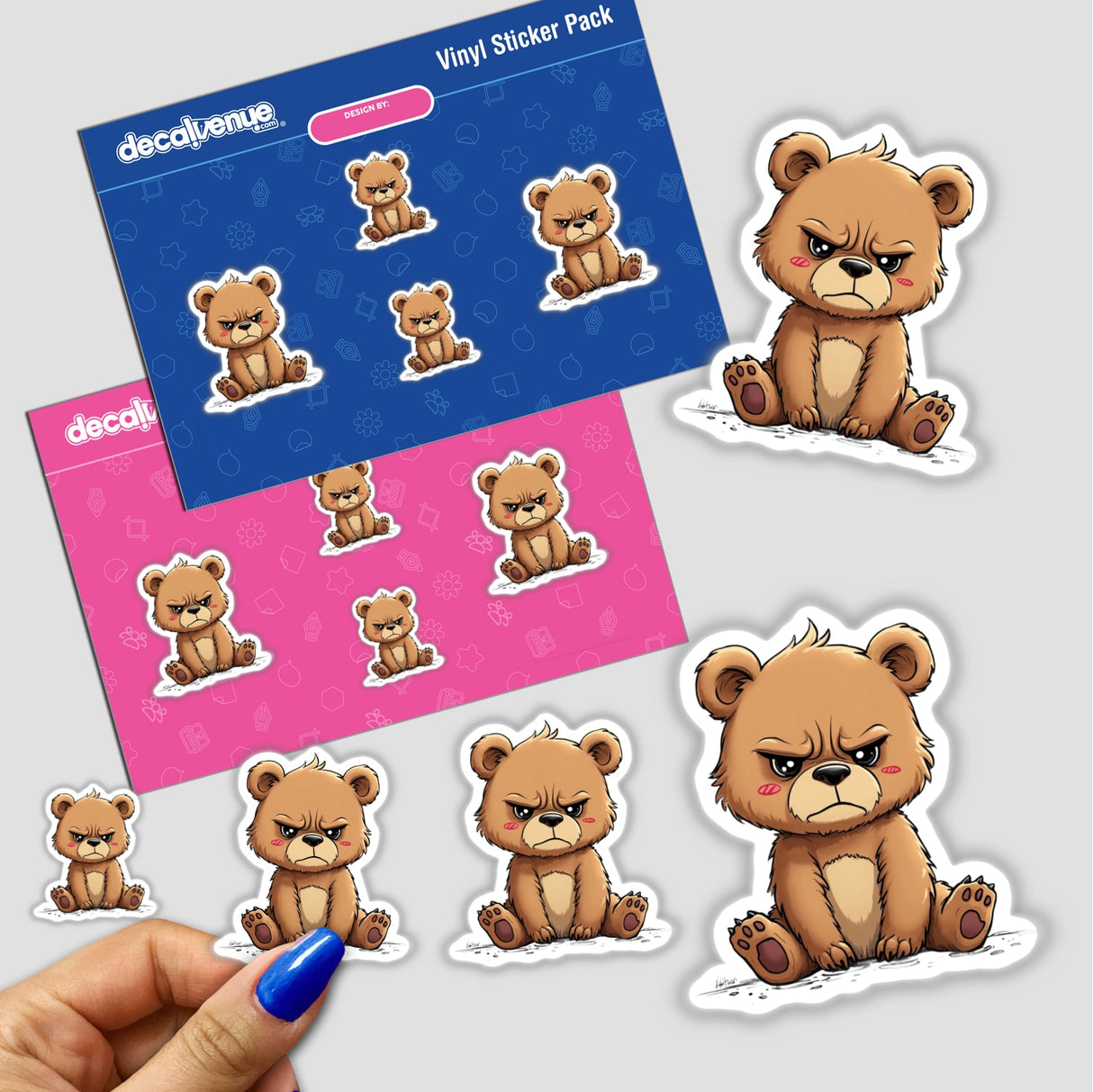 Hand holding a sticker pack featuring various Adorably Grumpy Bear cartoon designs.