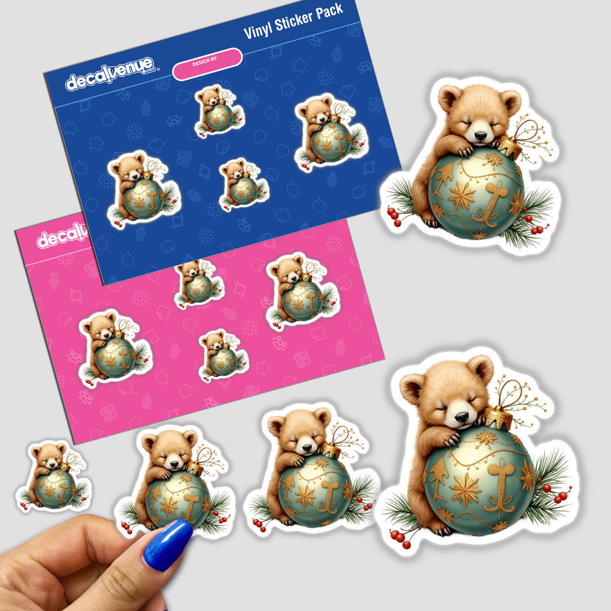 Bear Cub Sleeping on Christmas Ornament stickers, featuring a cute teddy bear curled around a festive ball. Perfect for decorating laptops, water bottles, or DIY projects.