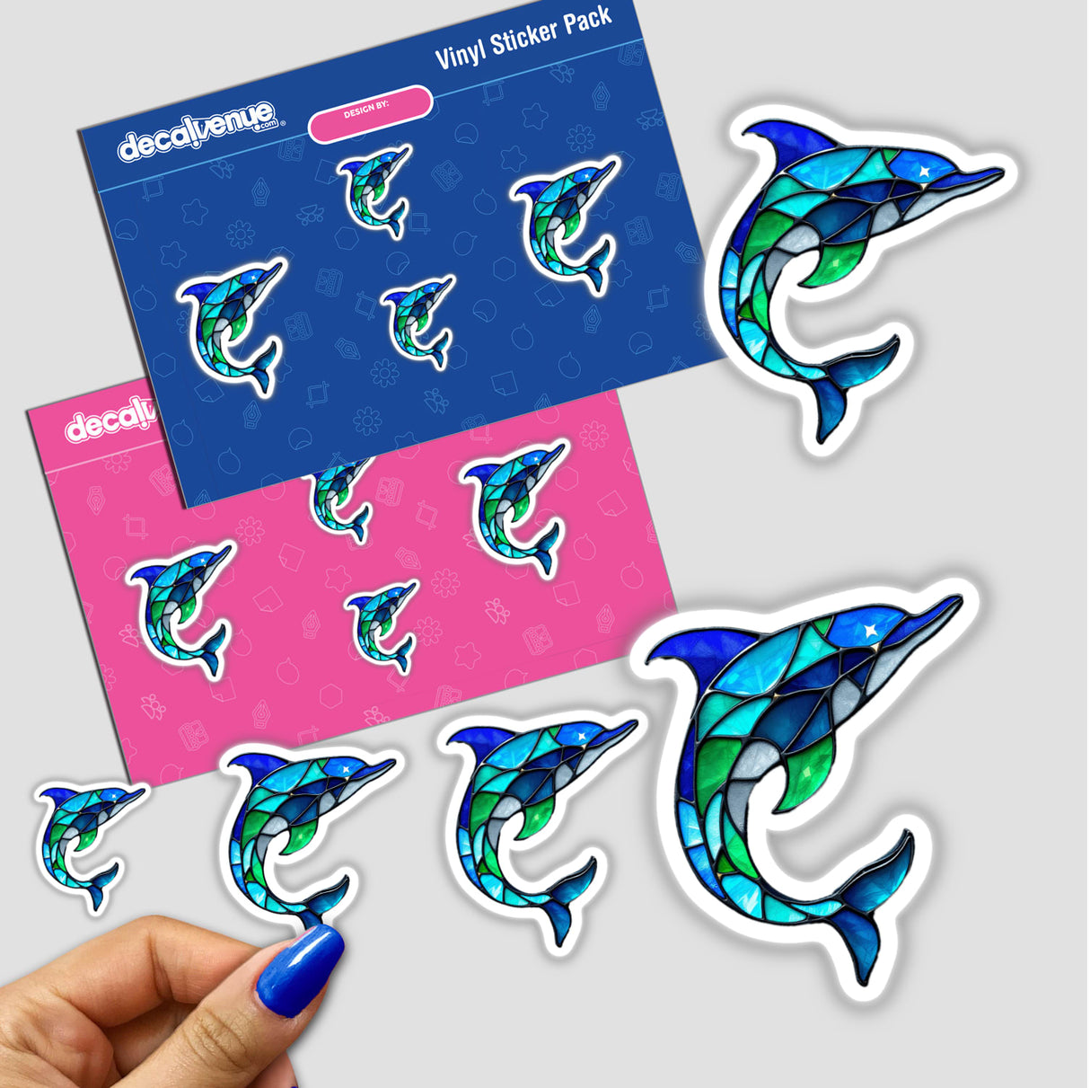 Dolphin Stained Glass Style sticker pack, featuring vibrant dolphin designs in a stained glass effect, held in hand. Available as stickers or digital artwork.