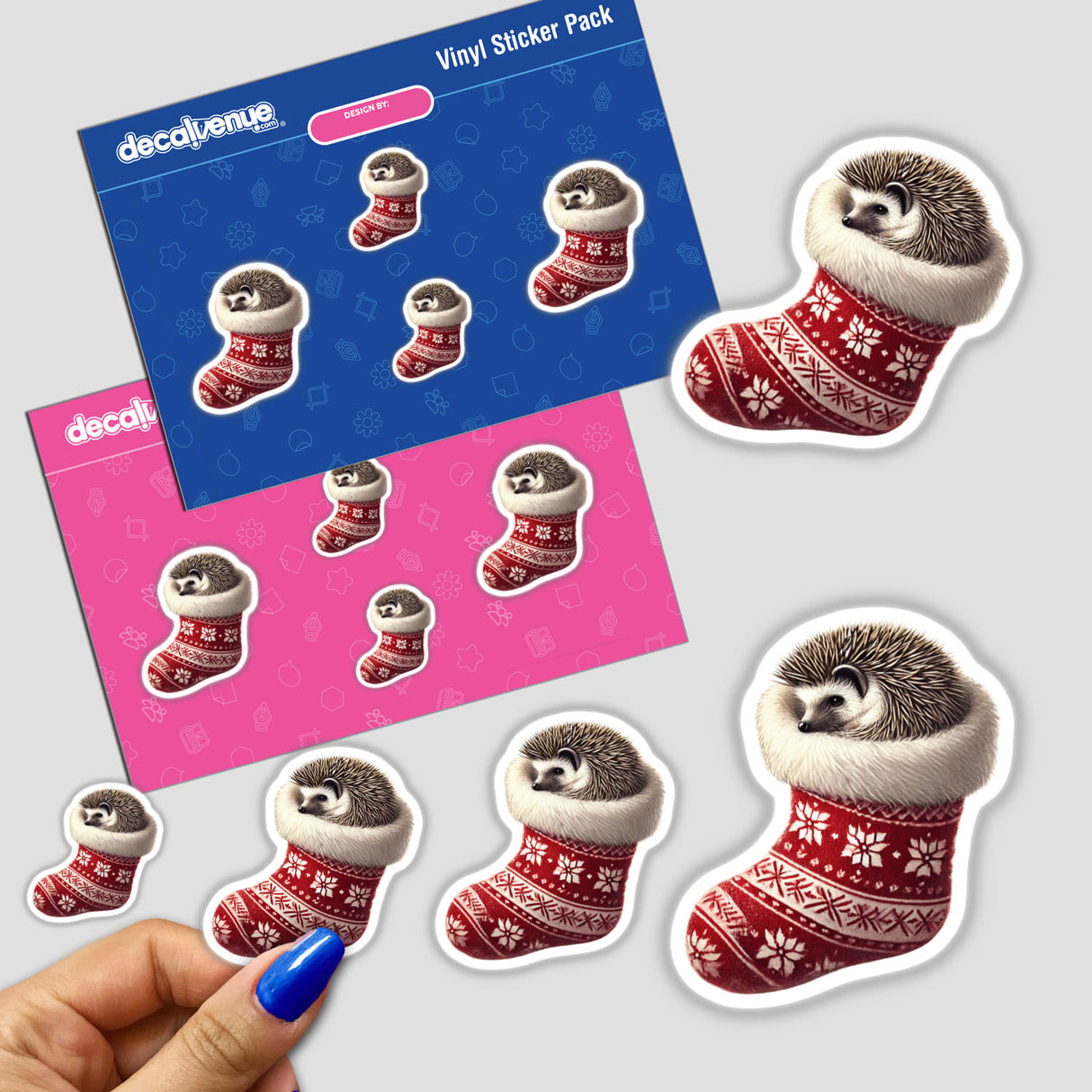 Sticker featuring a hedgehog curled up in a red and white Christmas stocking, held by a hand.