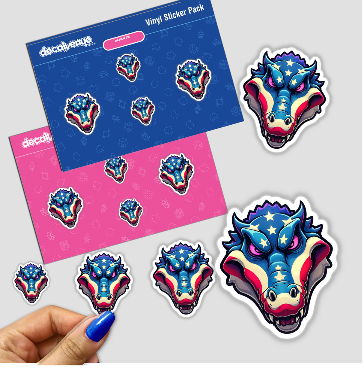 Hand holding a sticker pack featuring a cartoon of A Cool American Flag Alligator, surrounded by various playful dragon and crocodile cartoon stickers, available as stickers or digital artwork.