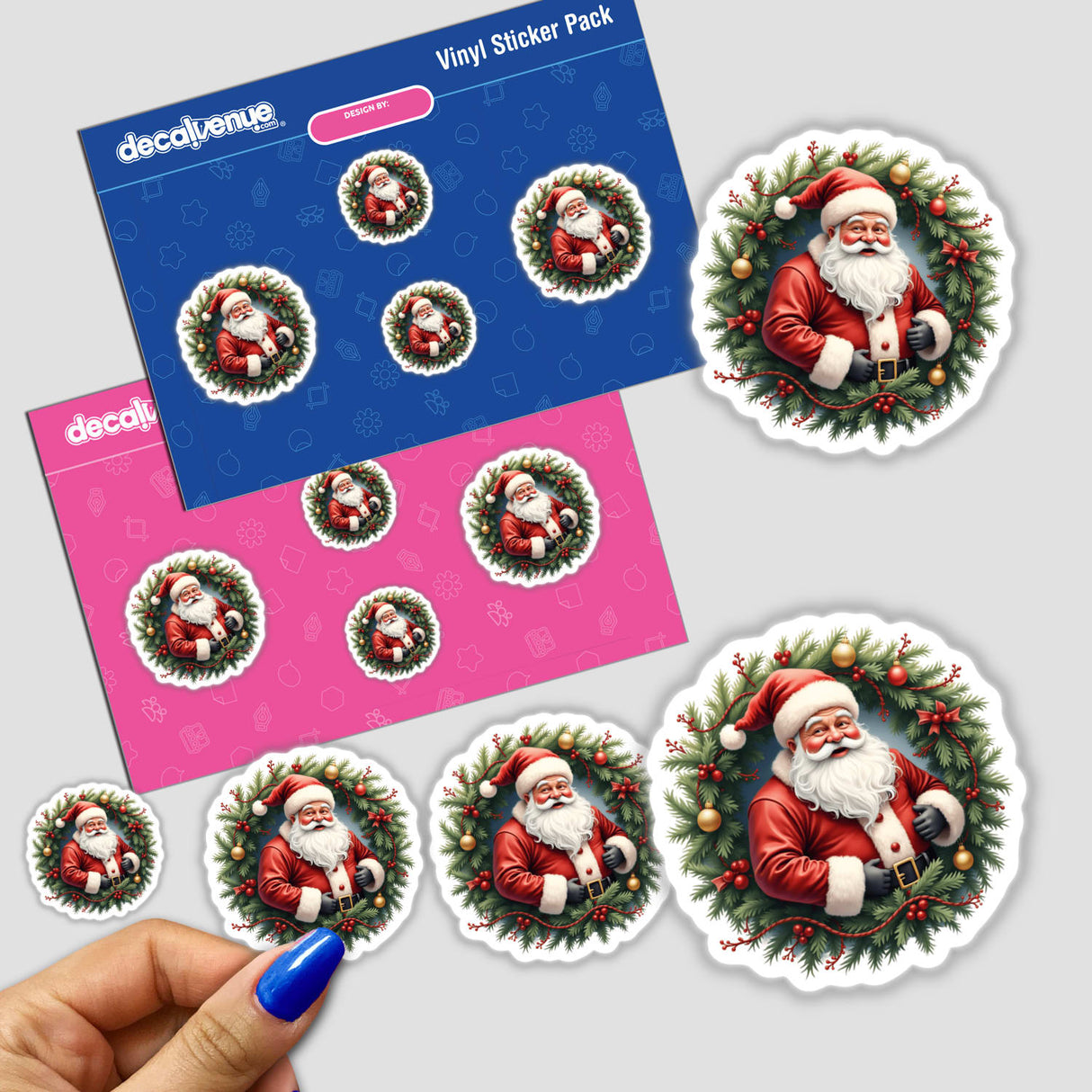 Jolly Santa Claus in a Christmas Wreath sticker pack, featuring a hand holding a Santa sticker. Available as stickers or digital artwork from Decal Venue's unique collection.