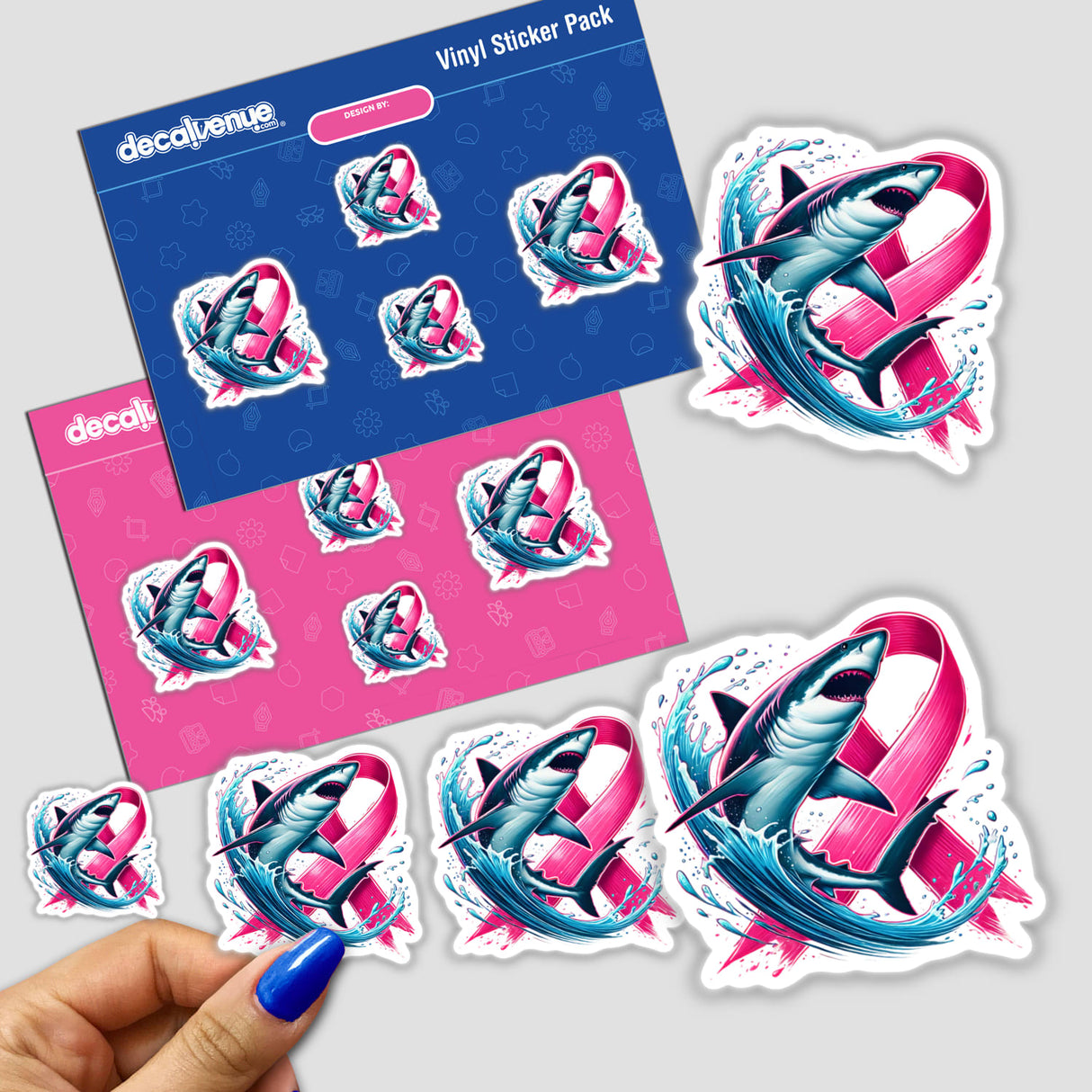 Sticker featuring a shark with a pink ribbon, symbolizing breast cancer awareness. A hand is shown holding the sticker for size reference.