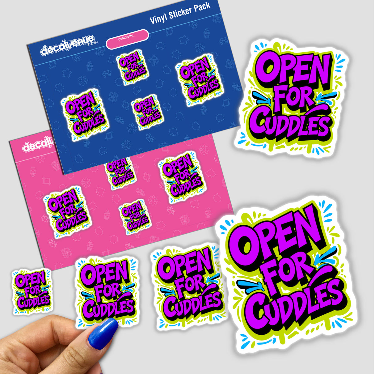 Open For Cuddles Funny Quote sticker held by a hand, showcasing playful typography. Available as a vinyl sticker or digital artwork, reflecting Decal Venue's unique design style.