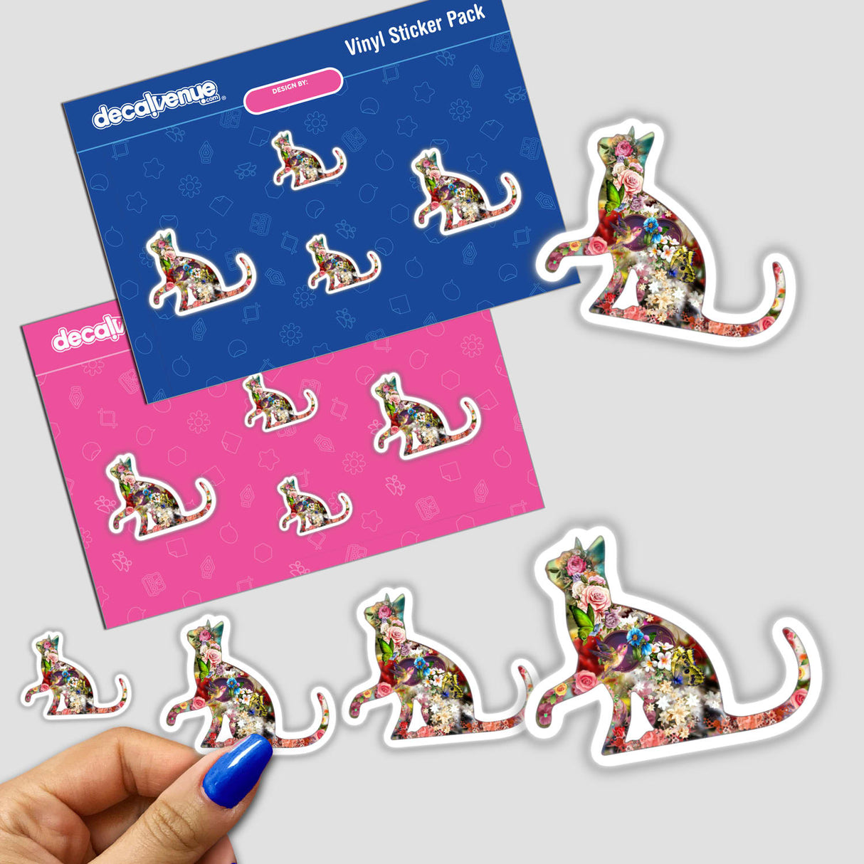 Colorful floral patterned kitty cat sticker pack from Decal Venue, featuring a larger digital artwork sticker and multiple smaller complementary stickers on a pink and blue background.