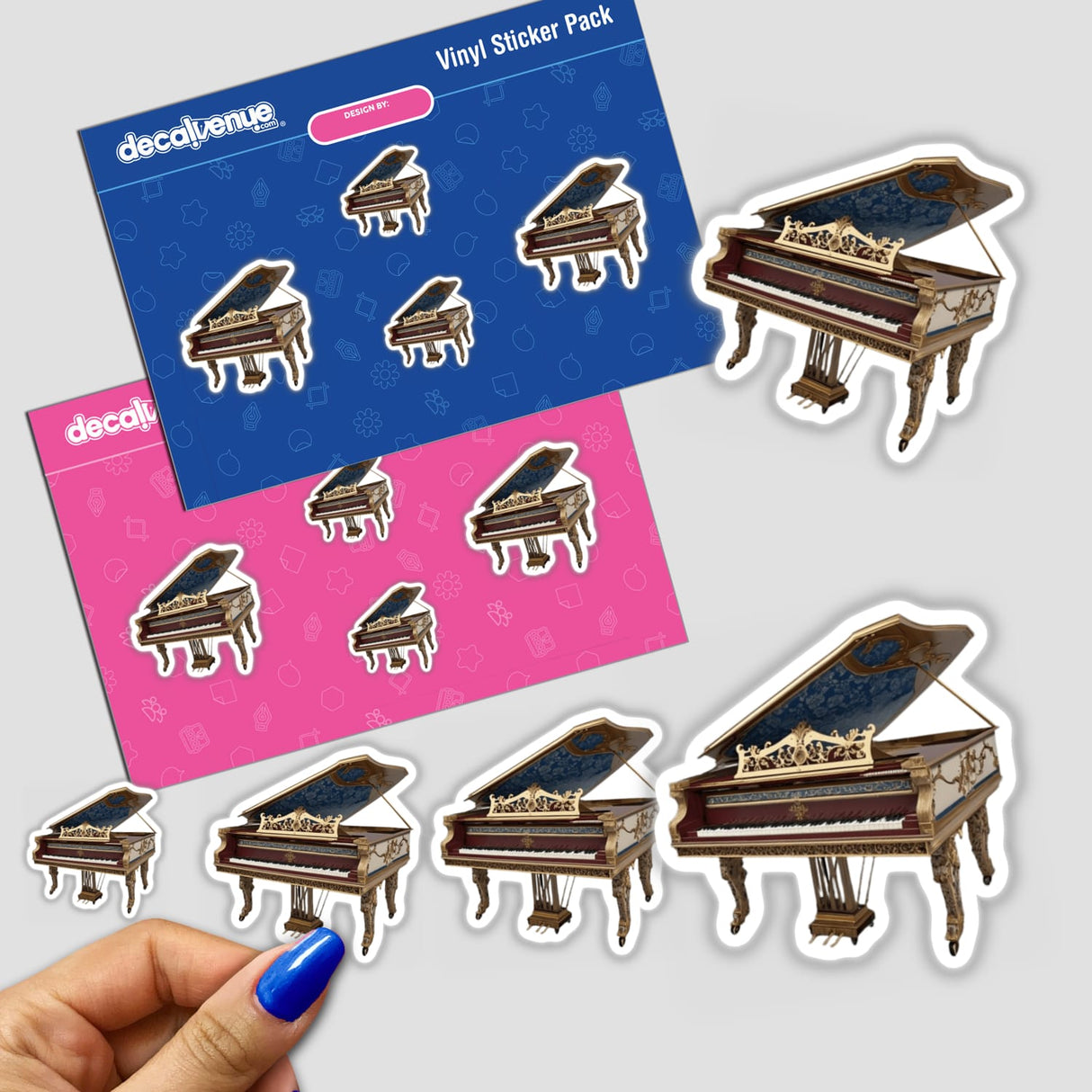 Baroque Harpsichord | Dark Academia Music Sticker depicts a hand holding a sticker pack featuring intricate harpsichord designs, highlighting Decal Venue's unique sticker collection. Ideal for music enthusiasts.