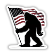 American Flag Sasquatch: A black silhouette of a Bigfoot holding a flag, available as stickers or digital artwork, showcasing unique vinyl design from Decal Venue.