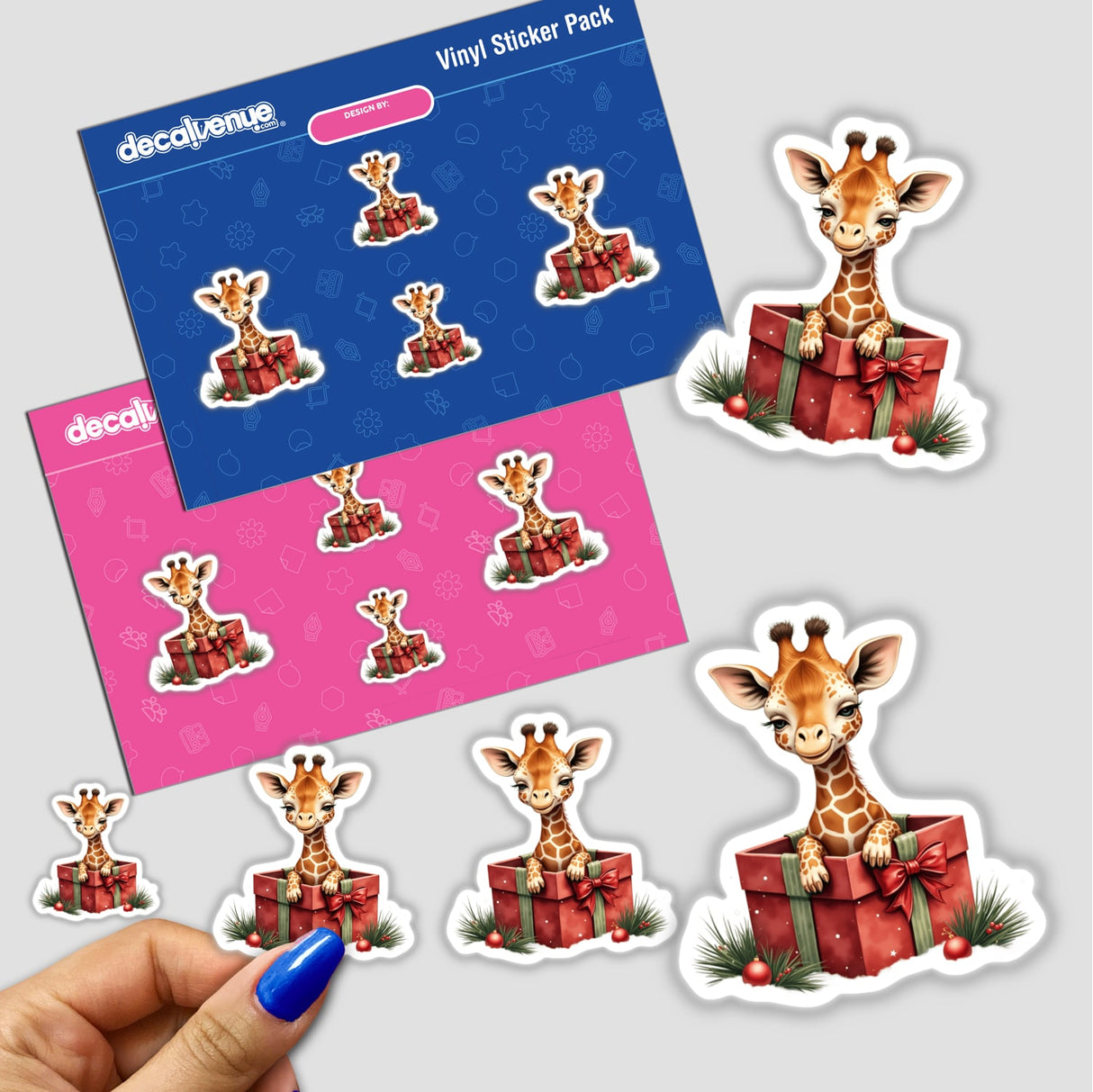 Giraffe in Christmas Present Box sticker pack, featuring cartoon giraffes in festive gift boxes, ideal for unique decoration. Available as stickers or digital artwork from Decal Venue.