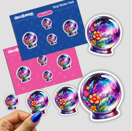 Hand holding a sticker pack featuring the Galaxy Landscape in a Crystal Ball: Cosmic Sticker Design. Close-up of a person's finger with a colorful flower in a glass ball sticker.