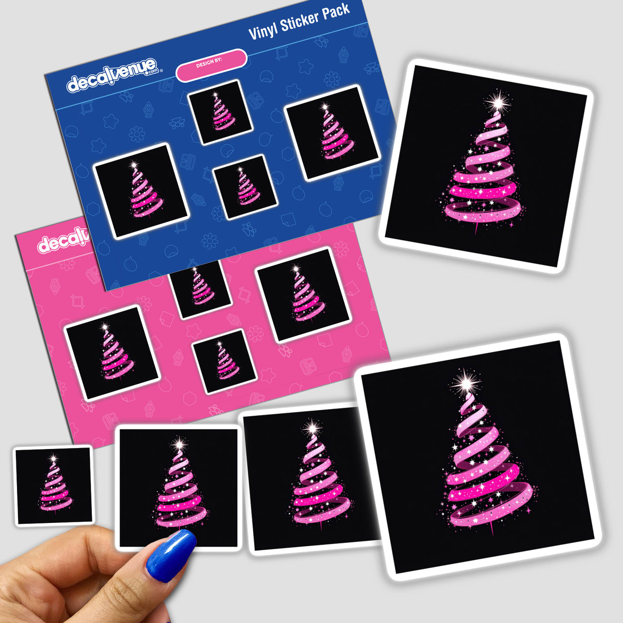 Pink Ribbon Christmas Tree sticker pack held in a hand, showcasing intricate designs available as stickers or digital artwork from Decal Venue, known for unique sticker collections.