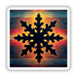 Snowflake Silhouette with Vibrant Stripes Christmas: A black snowflake silhouette set against a colorful, artistic background, available as stickers or digital artwork.