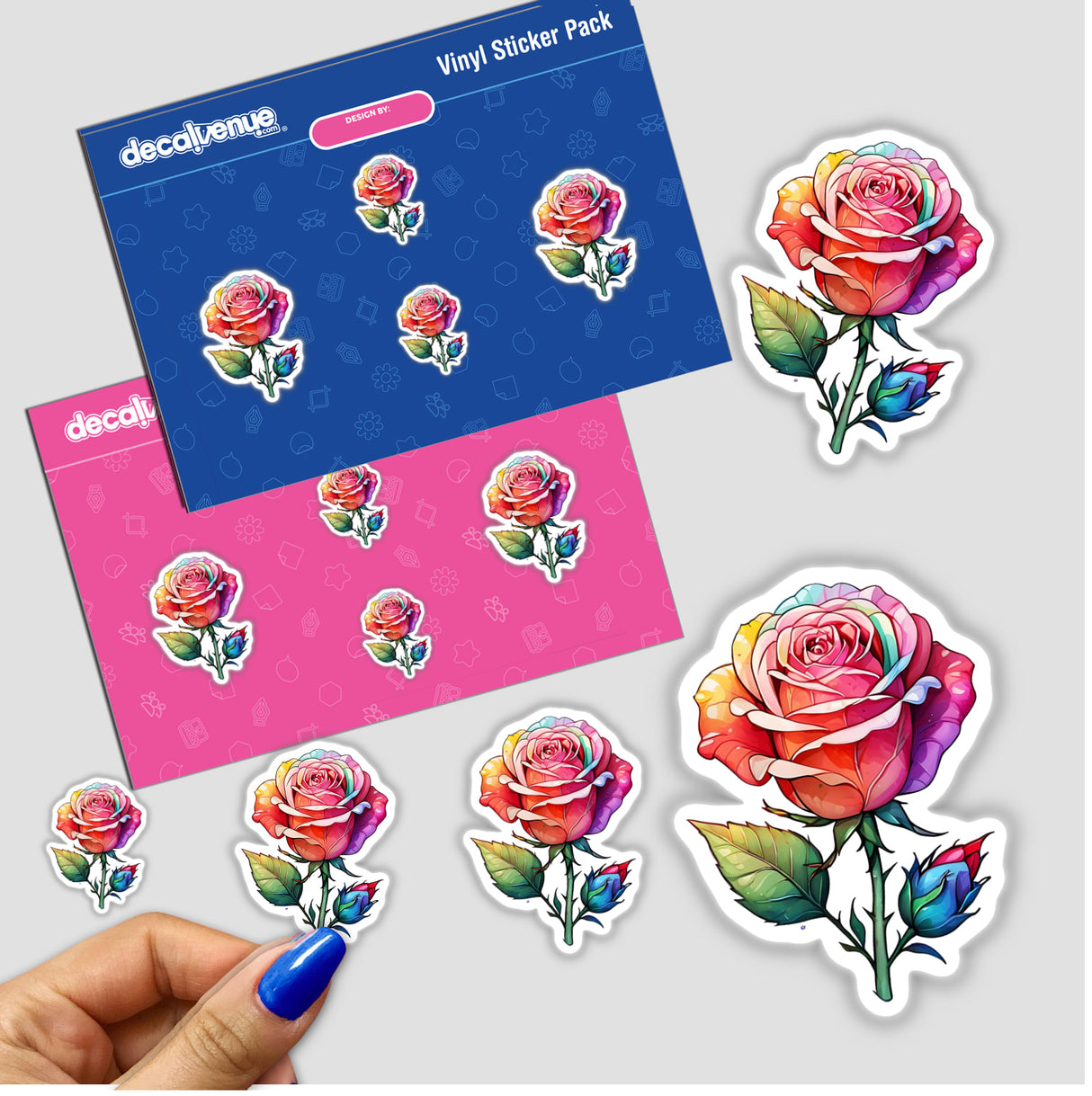 Vibrant Rose and Bud Sticker Design: A close-up of a hand holding a detailed sticker depicting a colorful rose with leaves, showcased among other floral-themed stickers.